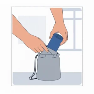 Illustration of a folded blue resistance band being tucked into a compact gym carrying bag.