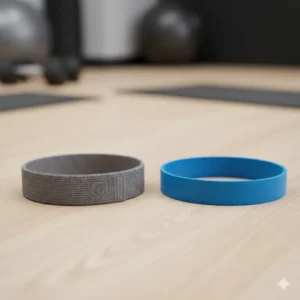 Comparison between a grey fabric short band and a blue latex short band for fitness.