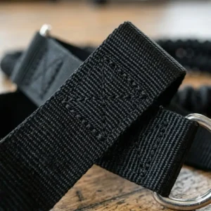 Close-up of reinforced nylon webbing and industrial-strength stitching on a premium exercise strap handle.