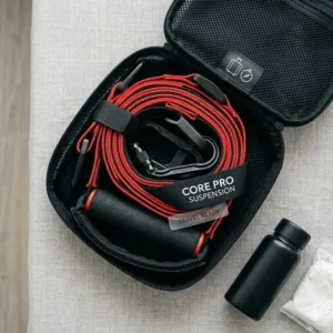 Compact and portable workout straps with handles stored inside a black travel carrying bag.