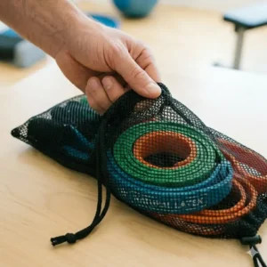 A black mesh carry bag designed for easy transport of youth resistance bands.